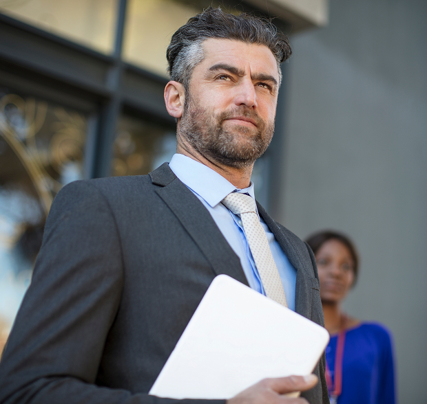 businessman-in-suit-waiting-outside-office-buildin-2024-09-15-23-25-24-utc 1